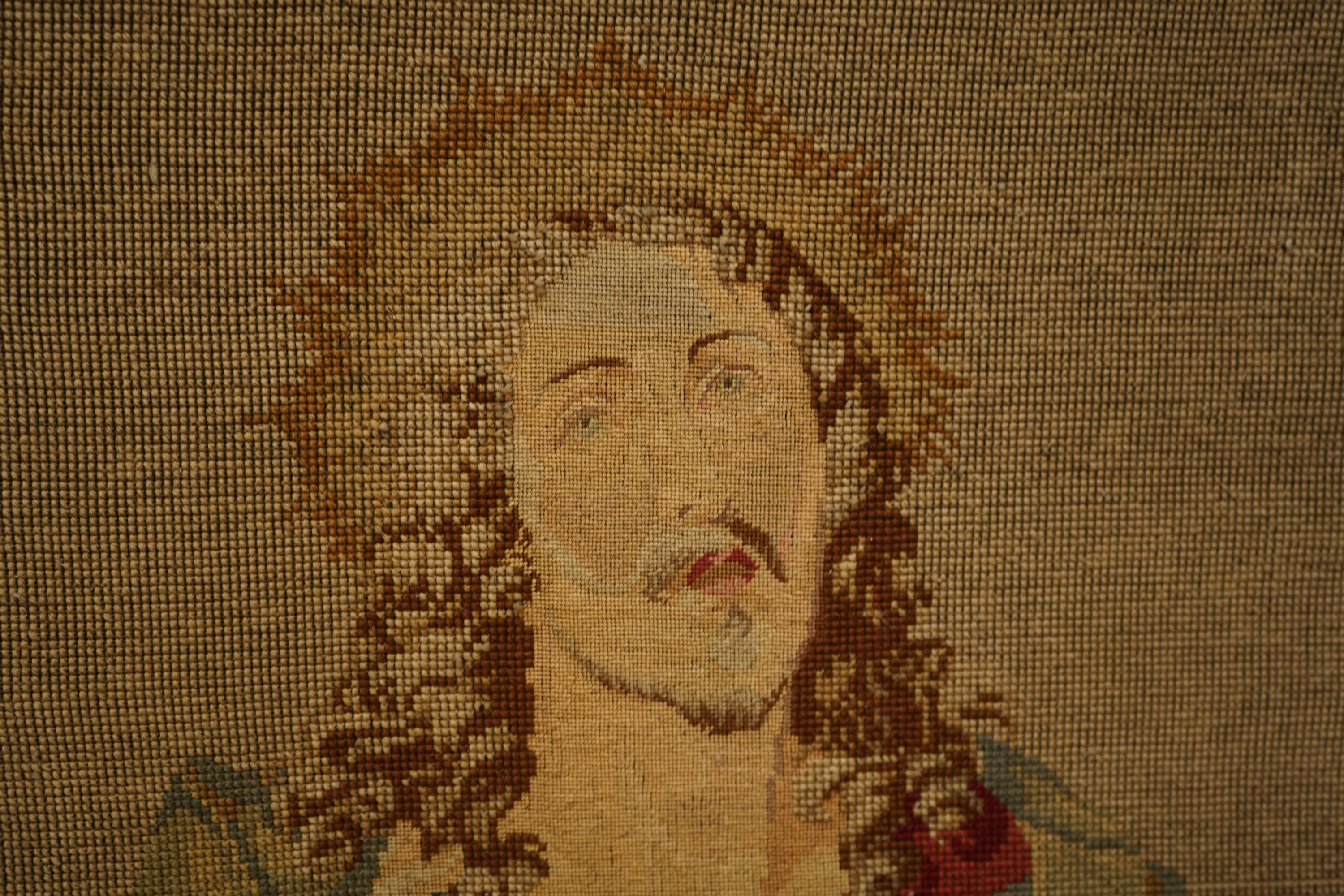 Two Victorian woolwork embroideries, one depicting Christ, the other John the Baptist both in carved gilt frames, largest 82cm high x 66cm wide